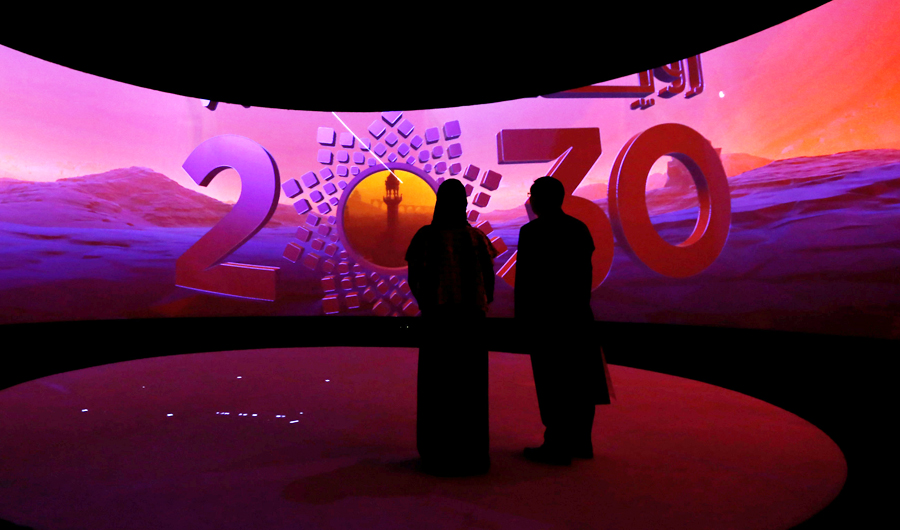 Visitors watch a 3D presentation during an exhibition on 'Neom', a new business and industrial city, in Riyadh, Saudi Arabia. (REUTERS file photo)