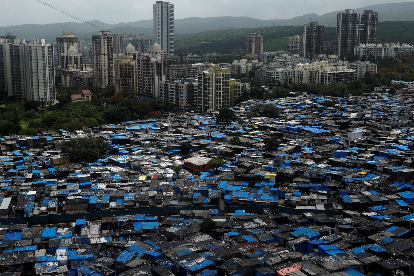 High-rise buildings tower over the slum in Mumbai, June 27, 2020. (Reuters)