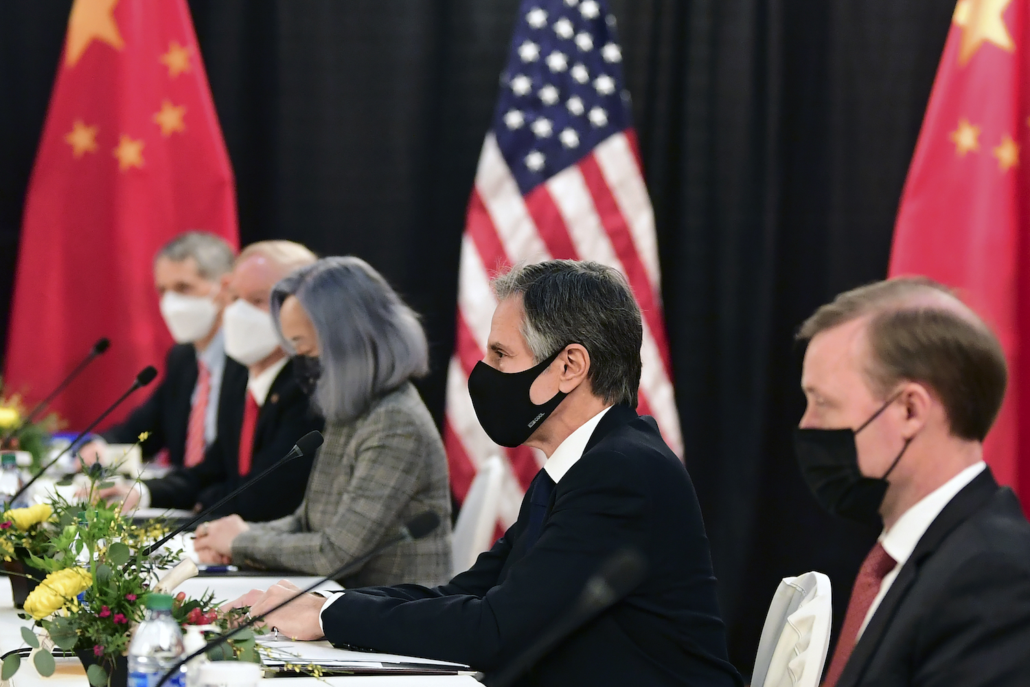 Antony Blinken and Jake Sullivan listen as they meet Chinese Communist Party foreign affairs chief Yang Jiechi and China's State Councilor Wang Yi in Alaska. (File/AP)
