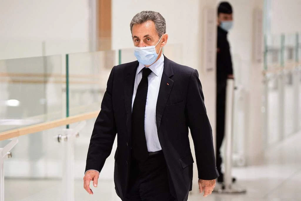 Former French President Nicolas Sarkozy arrives for a hearing of his trial on corruption charges at a Paris courthouse, December 8, 2020. (AFP)
