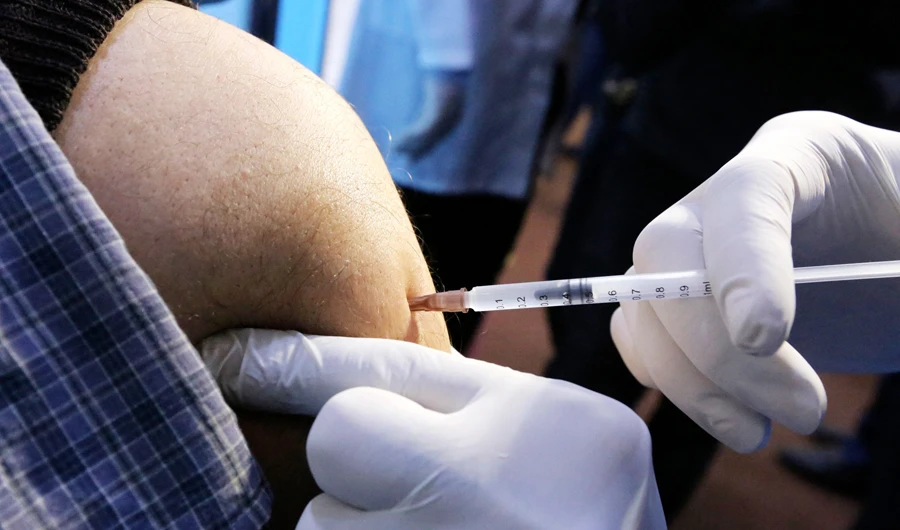 Iraqis get vaccinated against Covid-19 with Chinese Sinopharm vaccine at a private nursing home in Baghdad on March 2, 2021. (AFP)