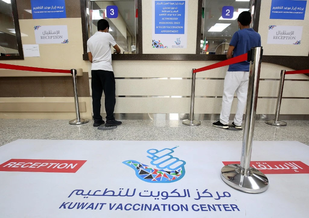 Above, people register to be inoculated at Al-Naseem COVID-19 vaccination center in Al-Jahra governorate, north of Kuwait on March 4, 2021. (AFP)