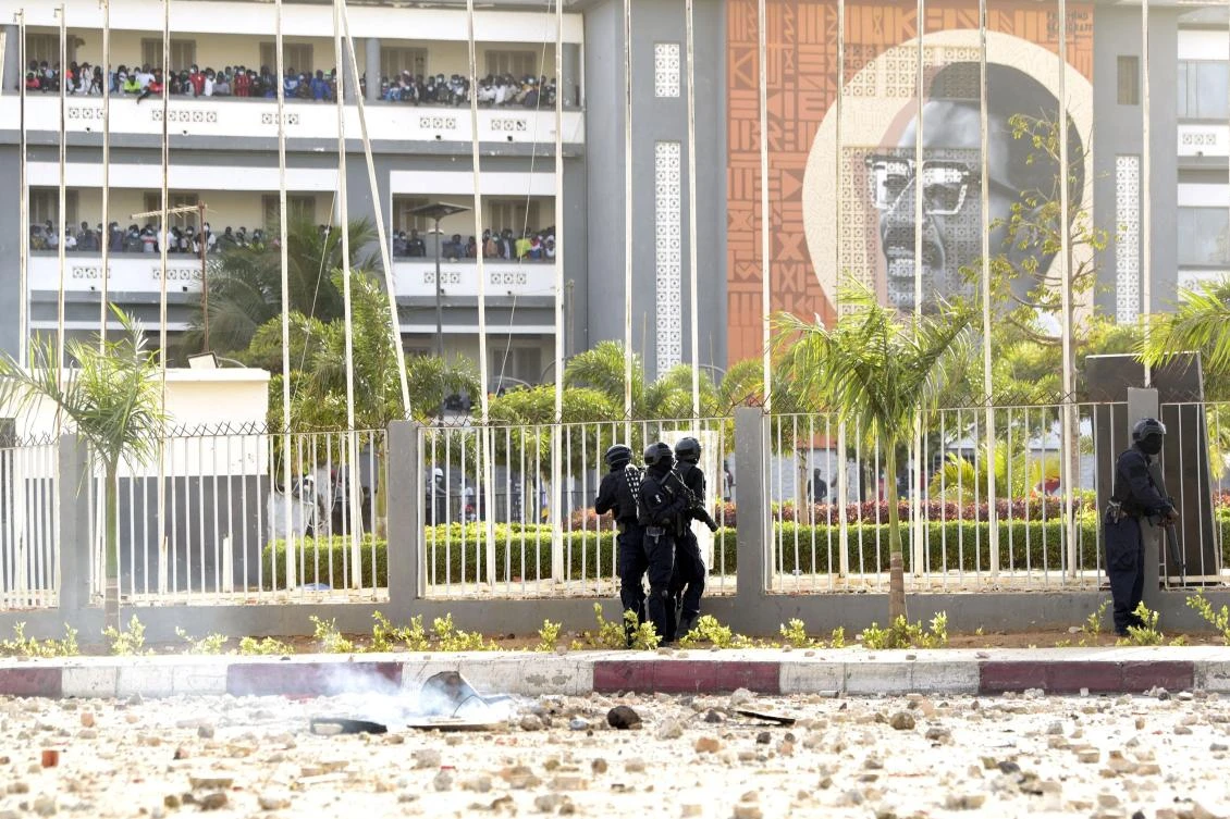 Members of a police special brigade conduct an operation to move out university students, who support arrested opposition leader Ousmane Sonko, from the "Centre des œuvres universitaires" (COUD) during in Dakar on March 4, 2021. (AFP)