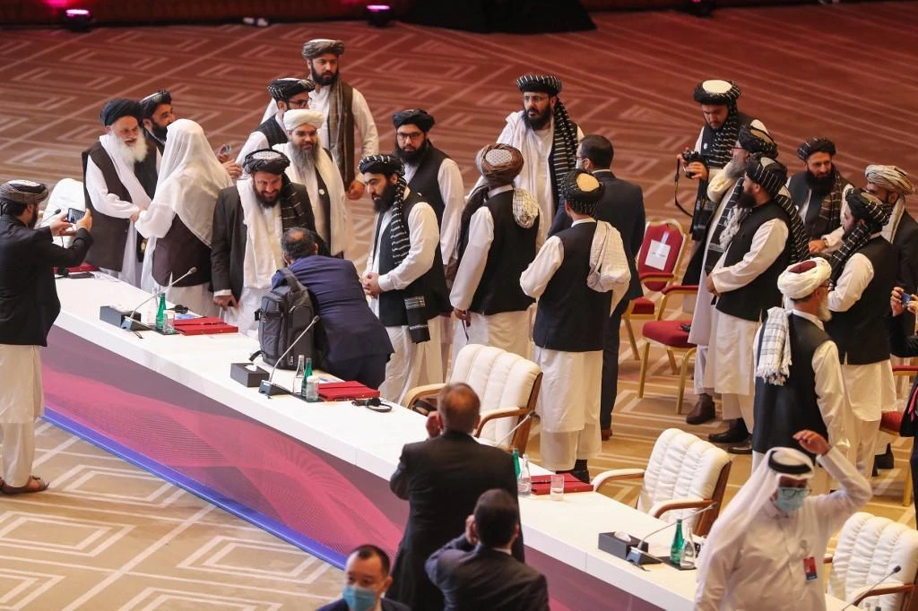 Above, members of the Taliban delegation during the peace talks between the Afghan government and the Taliban in Doha on Sept. 12, 2020. (AFP)