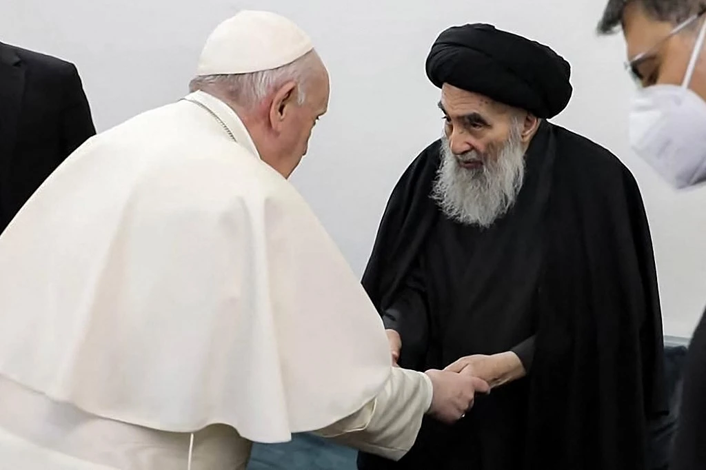 This handout picture released by Ayatollah Ali Al-Sistani's office shows Iraq's most revered Shiite cleric meeting Pope Francis and his delegation in Najaf on March 6, 2021. (AFP)