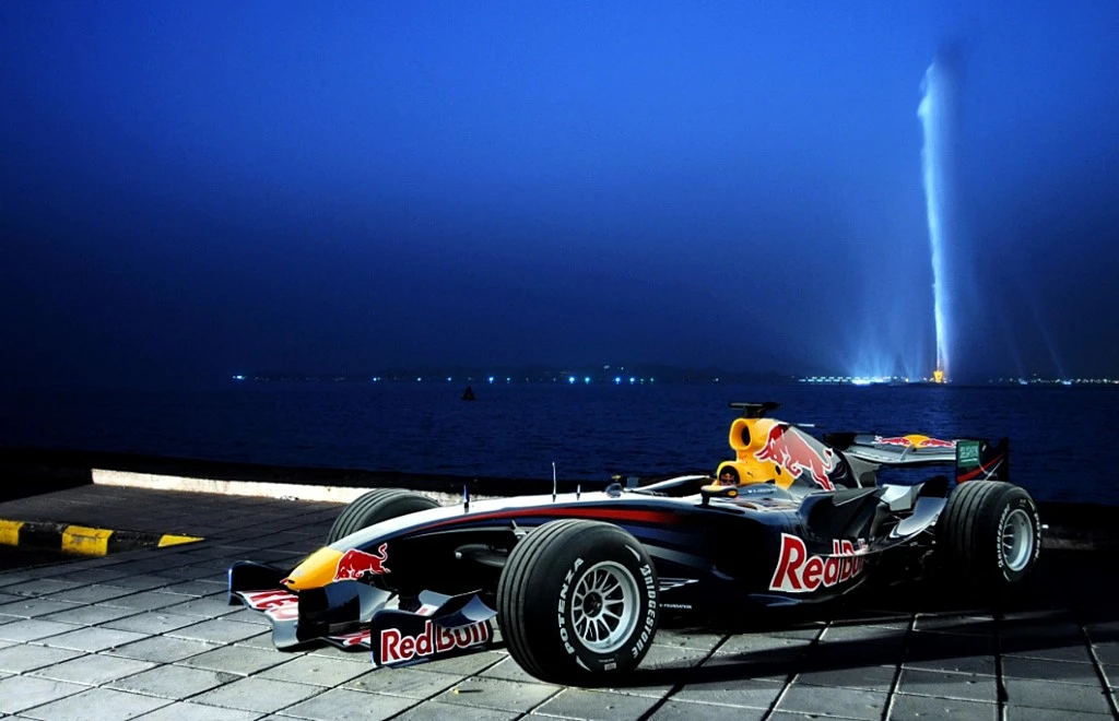 A handout picture from Red Bull dated March 7, 2008 and made available on March 13, 2008 shows the RB3 Red Bull Formula One car parked by the Sea in the Red Sea-side Saudi city of Jeddah, across from the King Fahd fountain. (File/AFP)