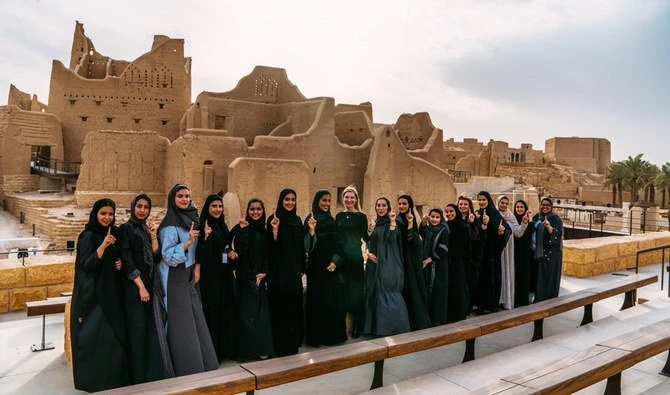 In this undated photo, a group of Saudi women posing in front of a historic sight at Diriyah, Saudi Arabia. (Supplied)