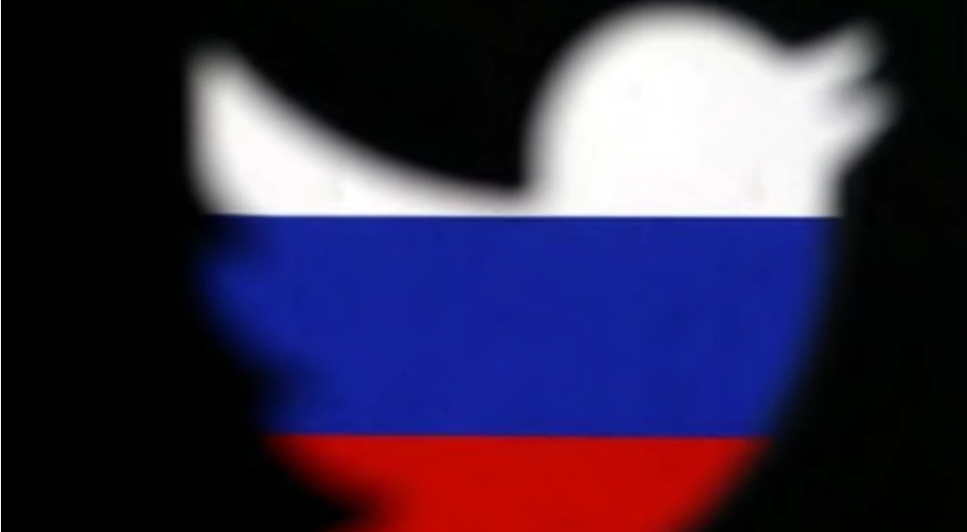 A 3D-printed Twitter logo displayed in front of Russian flag, October 27, 2017. (Reuters)