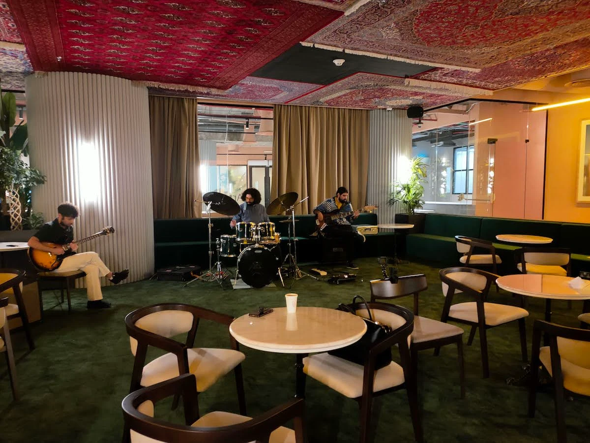 The center of the members lounge where guests can enjoy podcasts, movie screenings, and live music from one of the bands such as Al Lawashi. (Supplied)