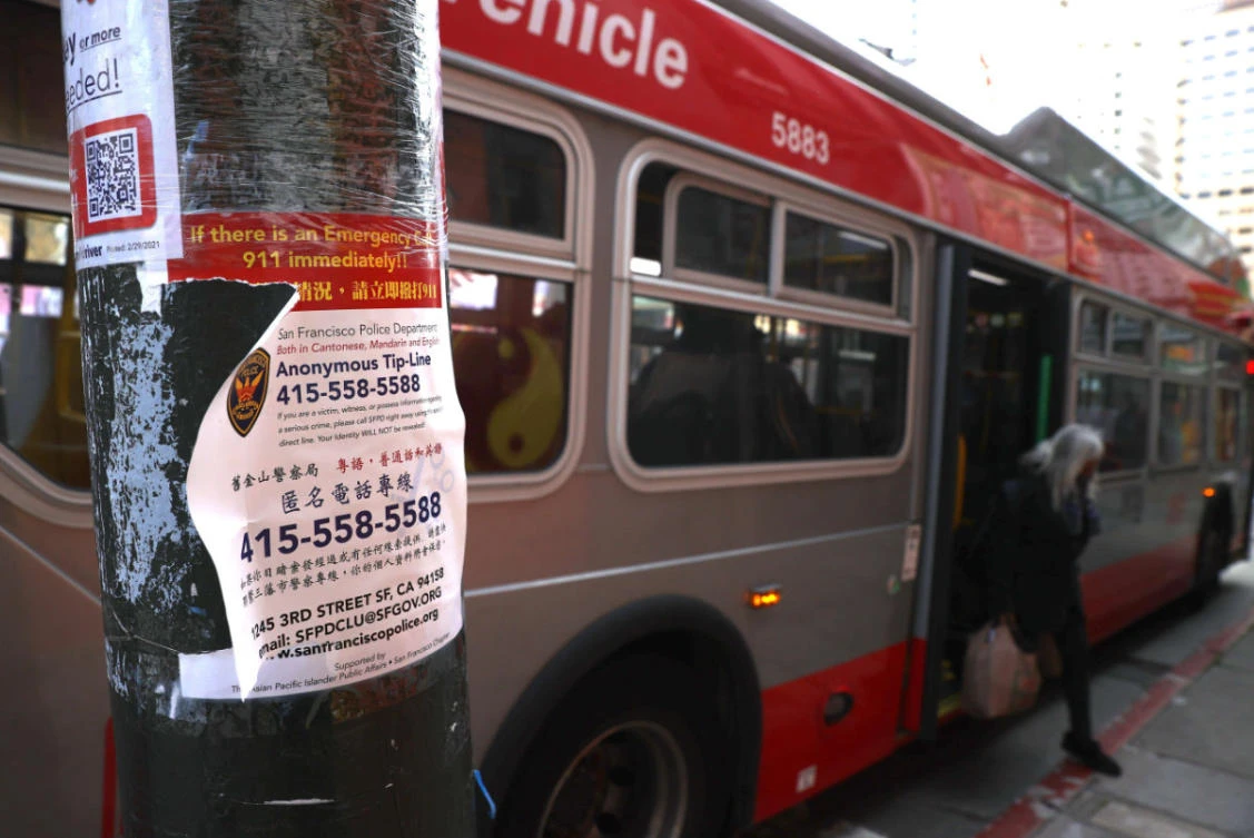 A sign is posted encouraging people to call a police tip line if they witness a crime on March 08, 2021 in the Chinatown neighborhood of San Francisco, California. (Justin Sullivan/Getty Images/AFP)