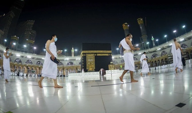 Handout picture provided by the Saudi Ministry of Hajj and Umrah on Oct. 4, 2020, shows Saudis and foreign residents circumambulating the Kaaba in the Grand Mosque complex in the holy city of Makkah. (AFP/File)