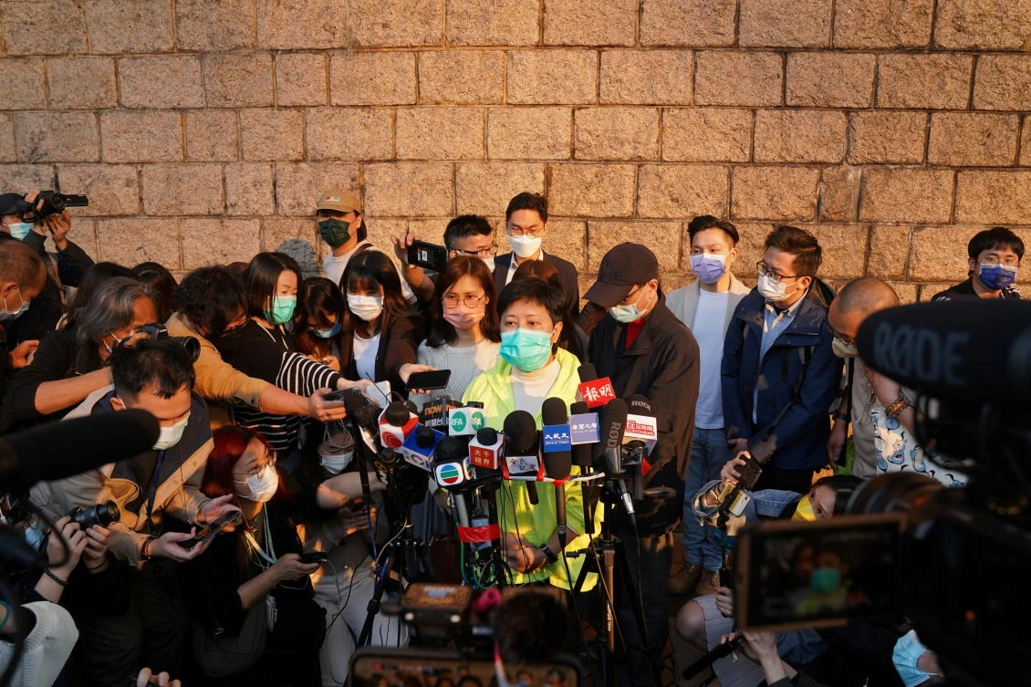 Former lawmaker Helena Wong Pik-wan, one of the 47 pro-democracy activists charged with national security violations, speaks to members of the media on March 11, 2021. (Reuters)