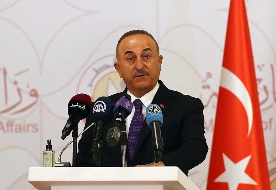 Turkish Foreign Minister Mevlut Cavusoglu attends a joint press conference following a tripartite meeting with his Russian and Qatari counterparts, on March 11, 2021 in Doha. (File/AFP)
