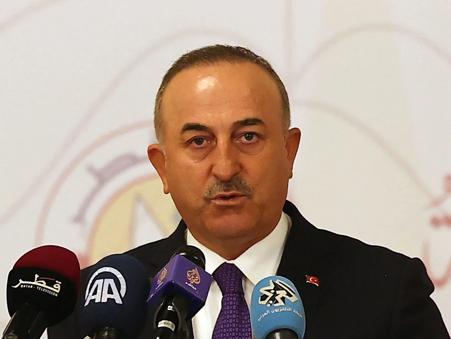 Turkish Foreign Minister Mevlut Cavusoglu attends a joint press conference following a tripartite meeting with his Russian and Qatari counterparts, on March 11, 2021 in Doha. (File/AFP)