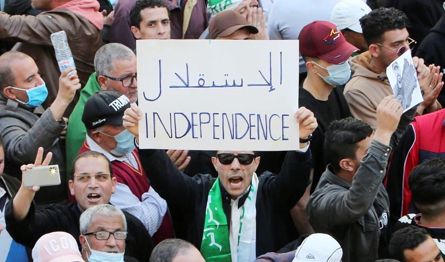 Protesters defied a coronavirus-related ban on gatherings to rally from different parts of Algiers on Friday. (Reuters)