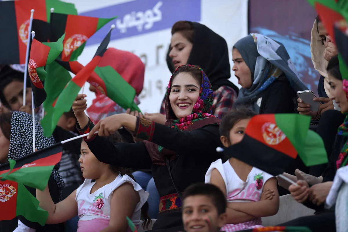 In this photograph taken on September 21, 2017, Afghan women watch a football match at the Afghanistan Football Federation stadium in Kabul. (AFP/File)
