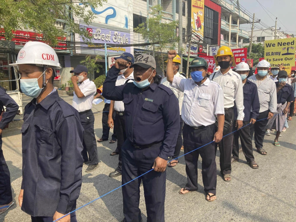 Protesters shout slogan as they protest against the military coup in Mandalay, Myanmar, Friday, March 12, 2021. (AP)