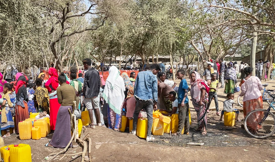 People displaced by the recent conflict gather around water points in Embadanso school in Shire, in the Tigray region of northern Ethiopia Tuesday, Feb. 23, 2021. (AP)