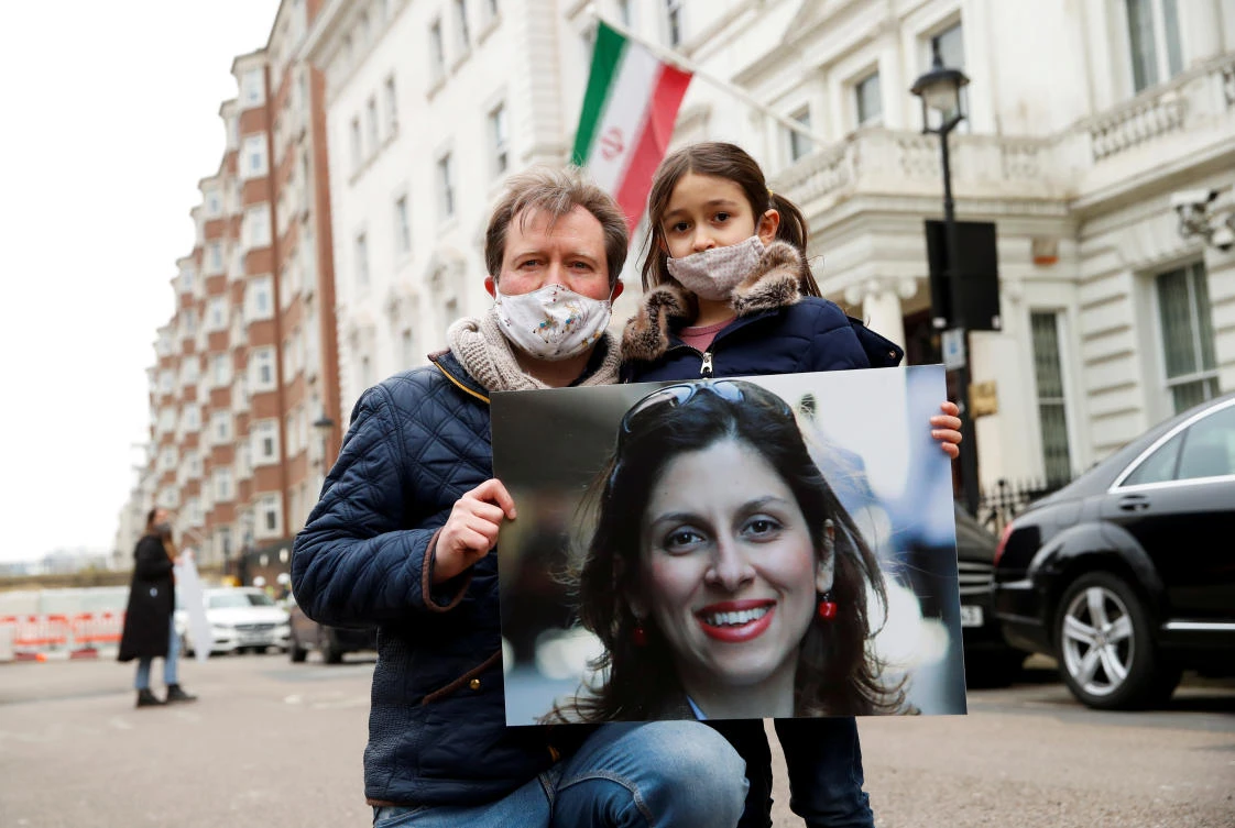 Richard Ratcliffe, husband of British-Iranian aid worker Nazanin Zaghari-Ratcliffe, and their daughter Gabriella protest outside the Iranian Embassy in London, Britain March 8, 2021. (Reuters)