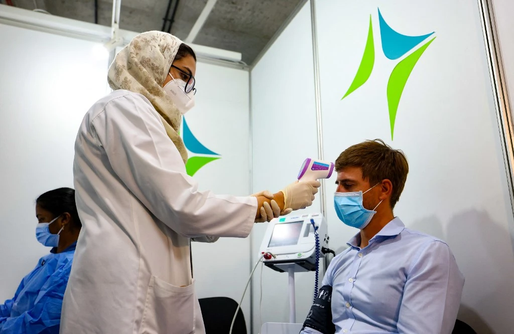 Coronavirus cases in the UAE hit below 2,000 for first time in over a month on Sunday, March 14. (AFP)