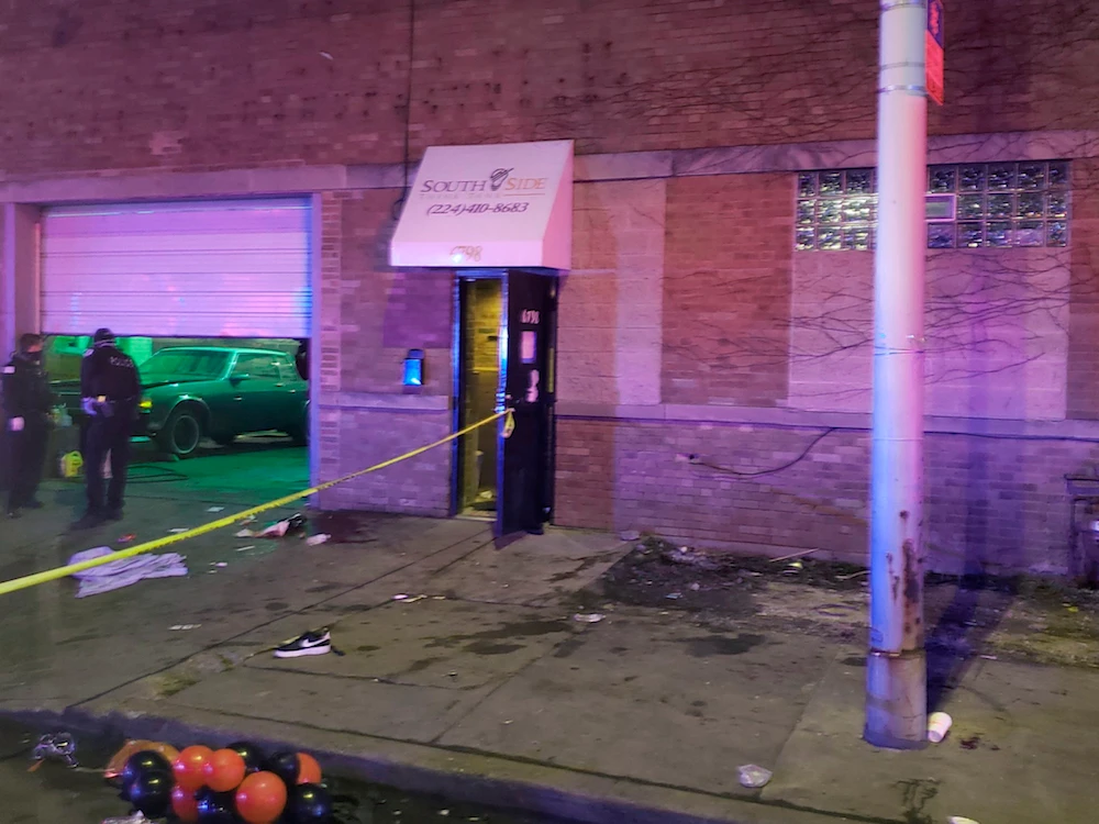 Police investigate the scene of a shooting early Sunday, March 14, 2021 in the Park Manor neighborhood in Chicago. (Chicago Fire Department/Chicago Sun-Times via AP)
