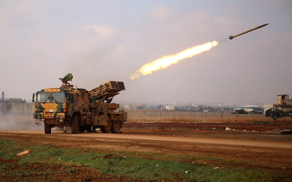 A Turkish mobile rocket launcher fires from a position near the village of Miznaz, on the western outskirts of Syria's Aleppo province, on February 14, 2020. (AFP)