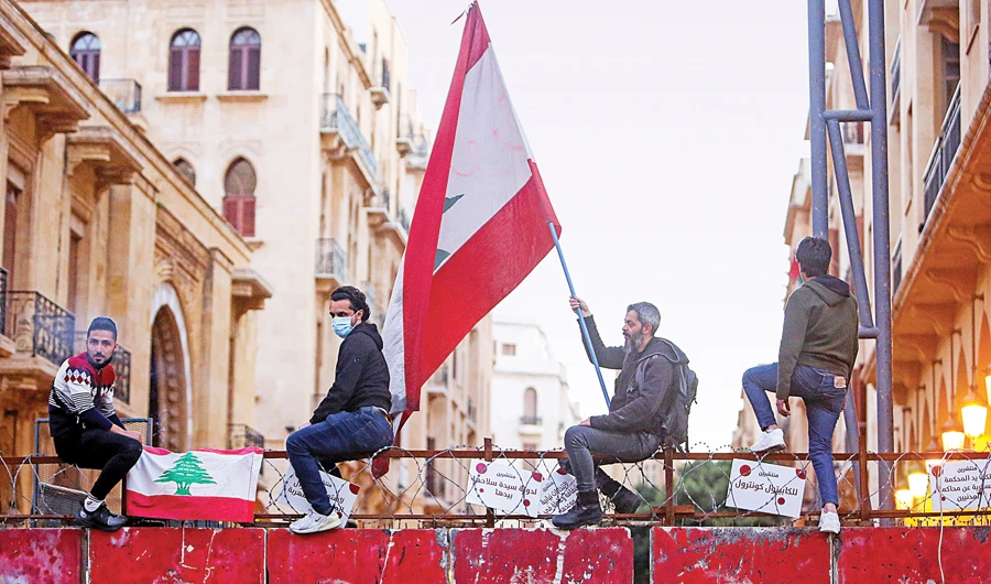 Lebanese demonstrators protest against the fall in Lebanese pound currency and mounting economic hardships in Beirut as the political stalemate continued. (Reuters)