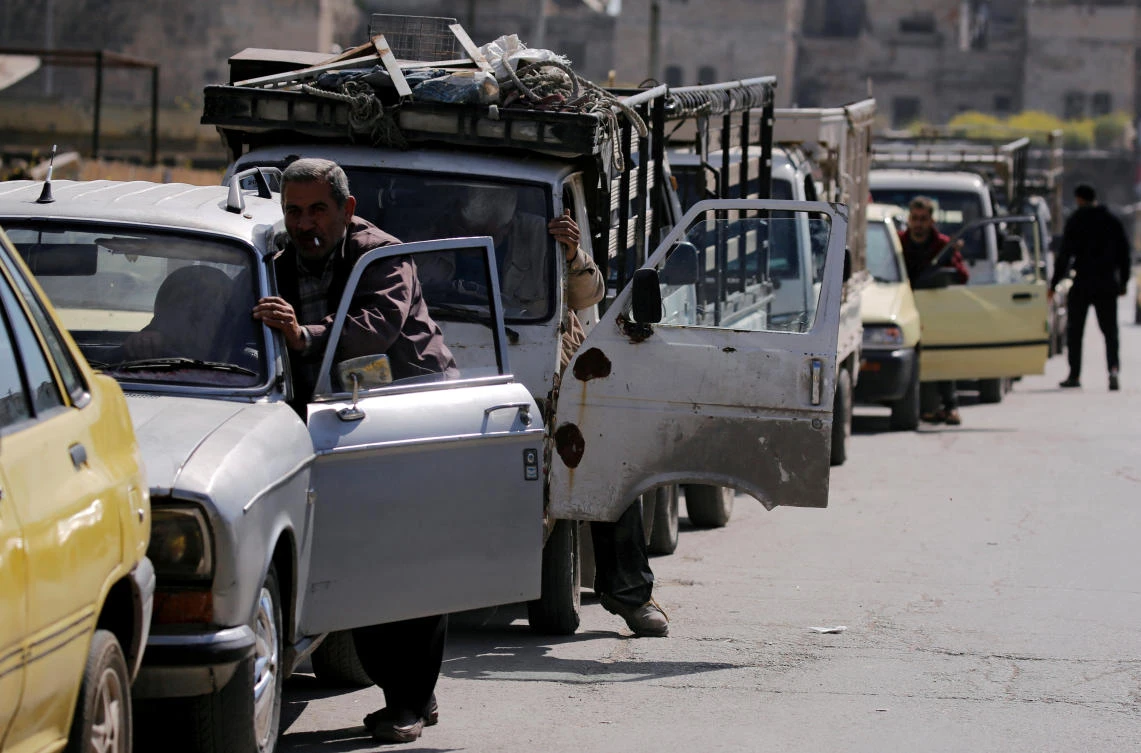 Cars stand in line at a gasoline station as they wait to fuel up in Aleppo, Syria. (Reuters)