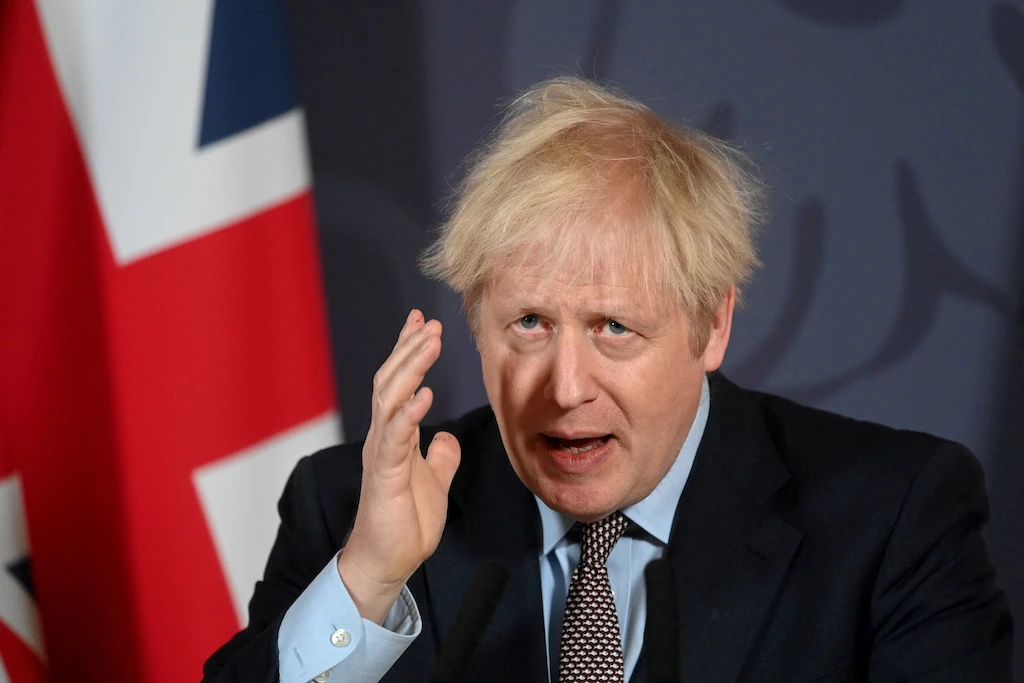 Boris Johnson holds a news conference in Downing Street on the outcome of the Brexit negotiations, in London Dec. 24, 2020. (Reuters)