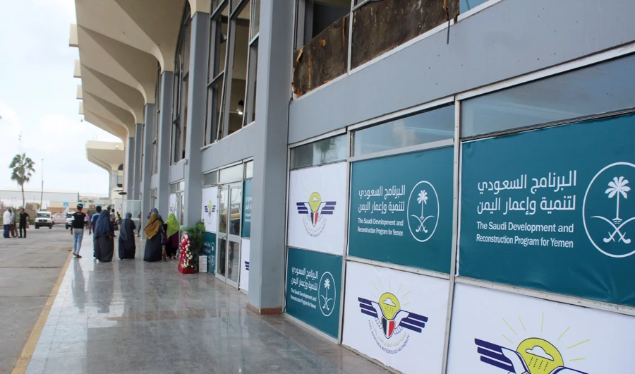 People stand outside of the airport building in Yemen's southern city of Aden on January 3, 2021. (AFP)