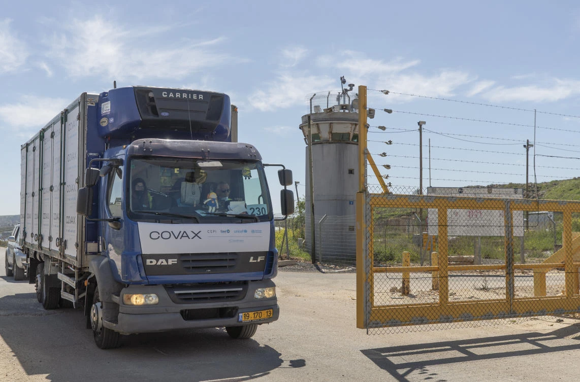A UN convoy carrying coronavirus vaccines passes through the Israeli Ofer crossing heading to a Palestinian health ministry's warehouse, on the outskirts of Ramallah on March 17, 2021. (AP)