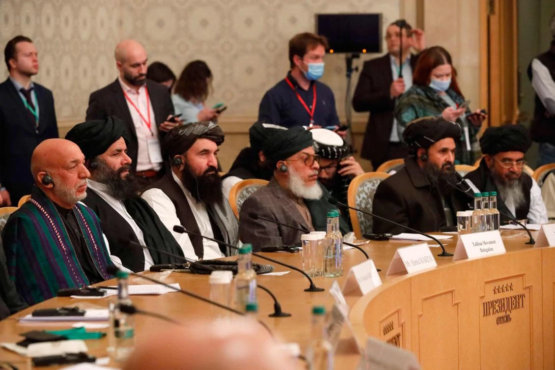 Former Afghan president Hamid Karzai, left, and Taliban co-founder Mullah Abdul Ghani Baradar, second right, attend an international conference on Afghanistan over the peaceful solution to the conflict in Moscow on March 18, 2021. (AFP)