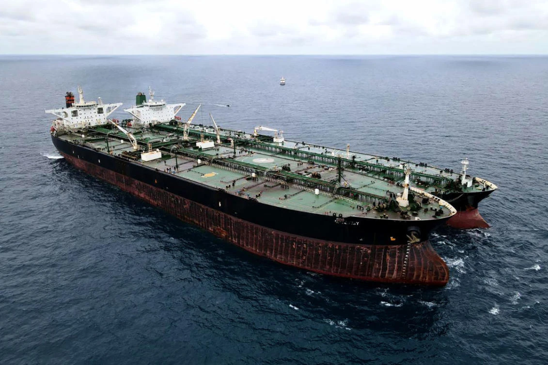 This file handout aerial photo taken on January 24, 2021 and released by the Indonesia Coast Guard shows a seized Iranian tanker and Panamanian vessel suspected of illegally transferring oil in Indonesian waters. (Indonesia Coast Guard via AFP)