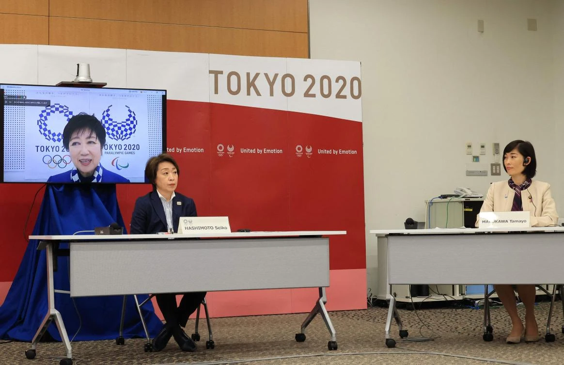 Tokyo Governor Yuriko Koike (on screen) speaks alongside Tokyo 2020 Organising Committee president Seiko Hashimoto (L) and Japan's Olympic Minister Tamayo Marukawa (R). (AFP)