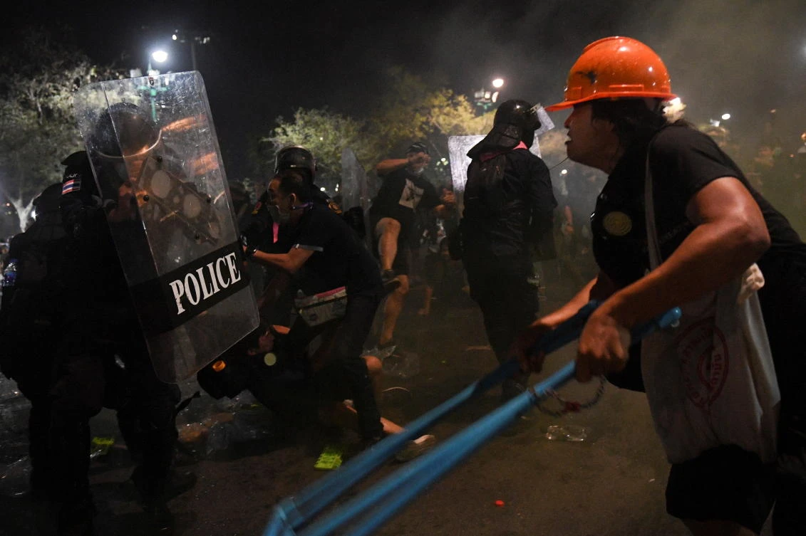 Demonstrators clash with riot police during an anti-government protest in Bangkok, Thailand on March 20, 2021. (Reuters)