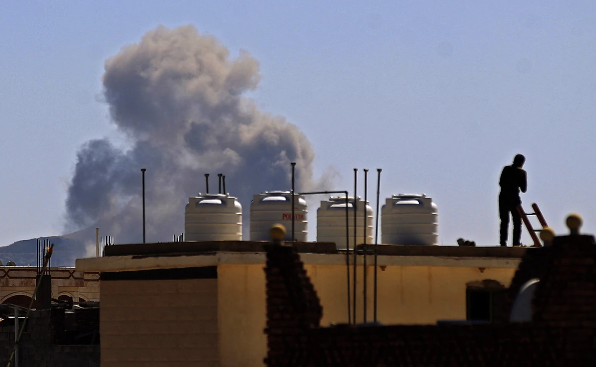 Smoke billows following a reported airstrike by the Saudi-led coalition in the Yemeni capital Sanaa, on November 27, 2020. (AFP/File)