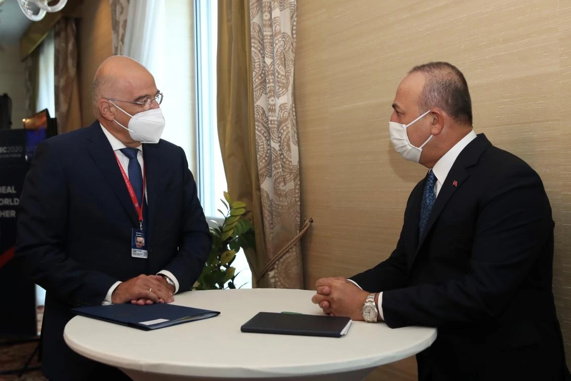Turkish Foreign Minister Mevlut Cavusoglu, right, meets with his Greek counterpart Nikos Dendias on the sidelines of the Global Security Forum in Bratislava, Slovakia, Oct. 8, 2020. (Reuters)
