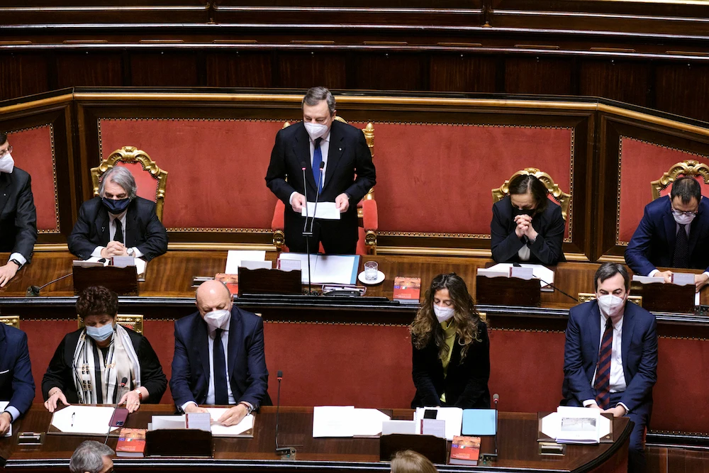 Italian Premier Mario Draghi, center, flanked by his cabinet ministers, addresses the Senate, Rome, Italy, March 24, 2021. (AP Photo)