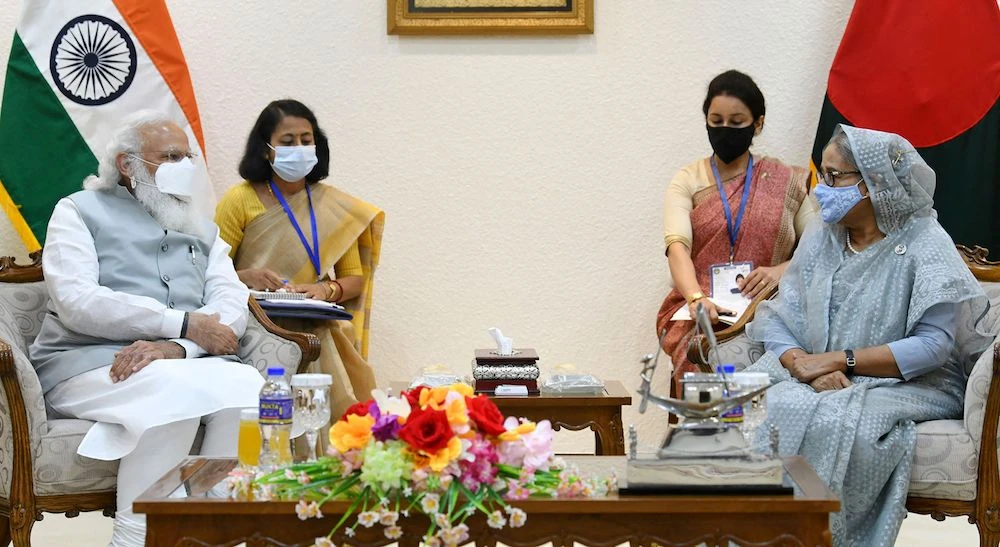 This handout photograph taken on March 27, 2021 and released by the Indian Press Information Bureau (PIB), shows Indian Prime Minister Narendra Modi (L) and his Bangladesh's counterpart Sheikh Hasina (R) during their meeting in Dhaka. (AFP)