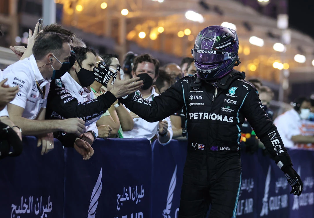 Lewis Hamilton celebrates with the Mercedes team. (Reuters)