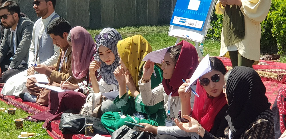 Participants from Afghan civil society listen to a speaker at a gathering in Kabul to discuss the country’s peace process on Monday. (AN photo by Sayed Salahuddin)