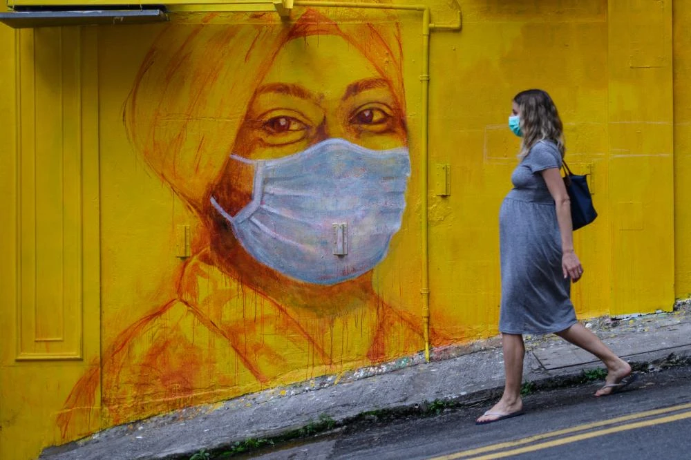 The review found that lockdowns, disruption to maternity services, and fear of attending health care facilities all added to pregnancy risks. (AFP)