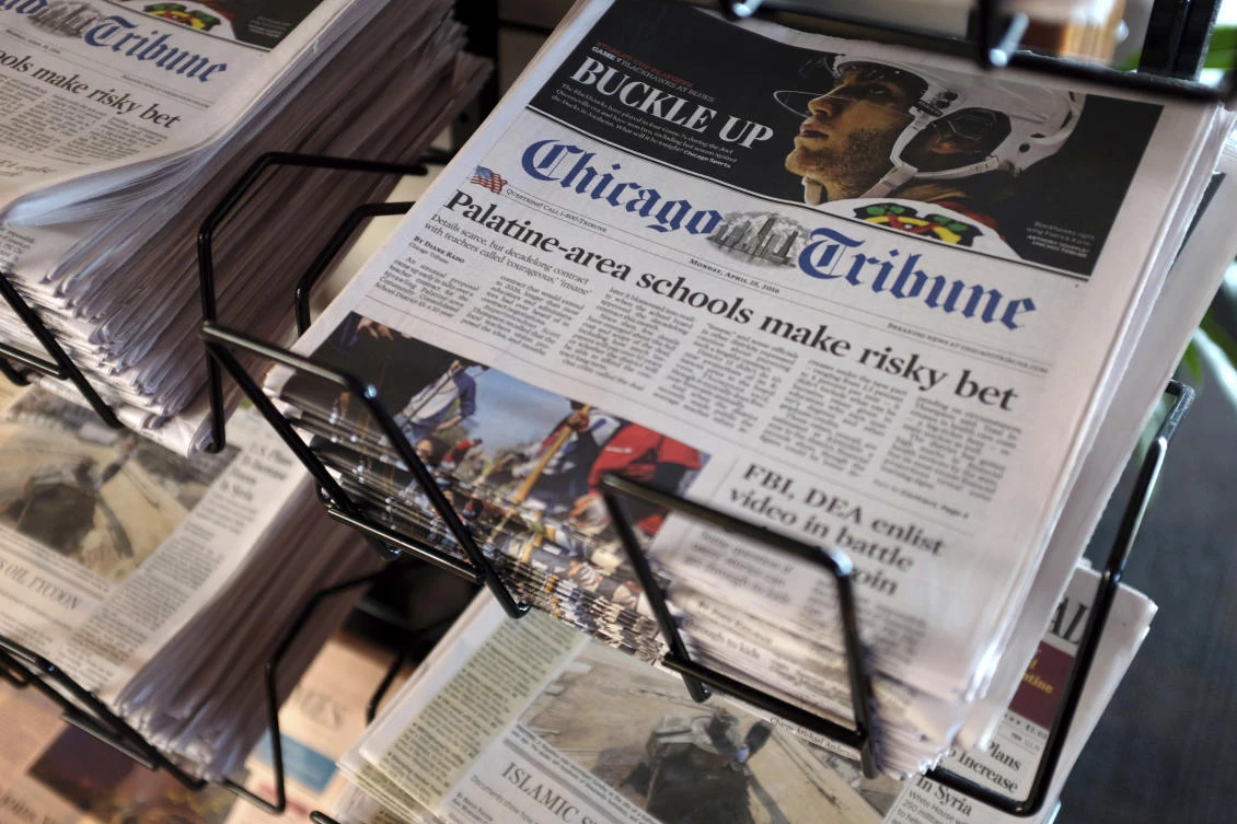 Tribune Publishing, which owns the Chicago Tribune, Baltimore Sun and other big regional dailies, was set to sell the company to Alden Global Capital at a value of $630 million. (AP)