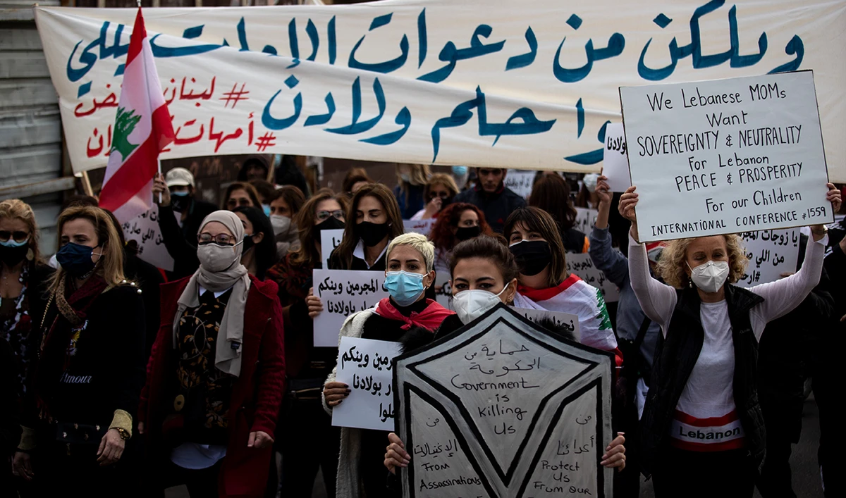 Protesters participate in a march against the political leadership they blame for the economic, financial crisis and 4 Aug. Beirut blast, in Beirut, Lebanon, Saturday, March 20, 2021. (AP)