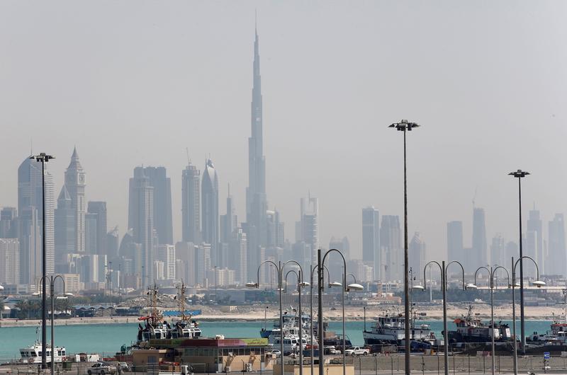 The skyline including the Burj Khalifa tower is seen as ships dock at Port Rashid in Dubai, United Arab Emirates, May 26, 2013. (Reuters)
