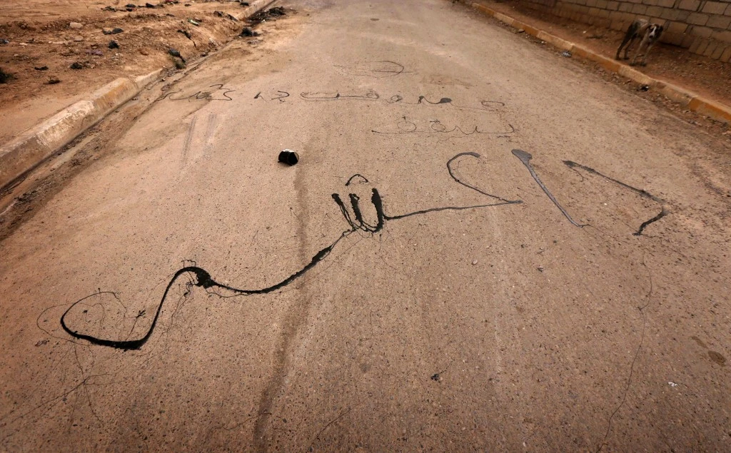 Above, a text reading in Arabic ‘Down with Daesh’ in this August 30, 2016 file photo after the militant group lost large swathes of territory it gained in a blitzkrieg. (AFP)