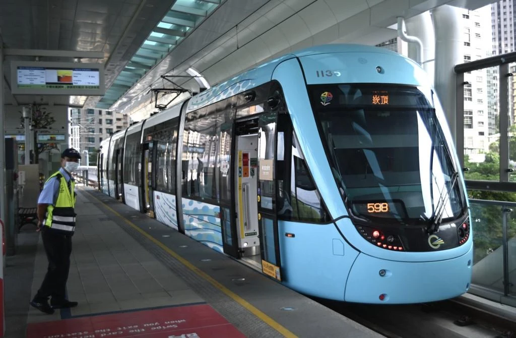 Picture taken on Aug. 21, 2019 shows a staff member standing next to a train of the Danhai Light Rail in New Taipei City. (File/AFP)