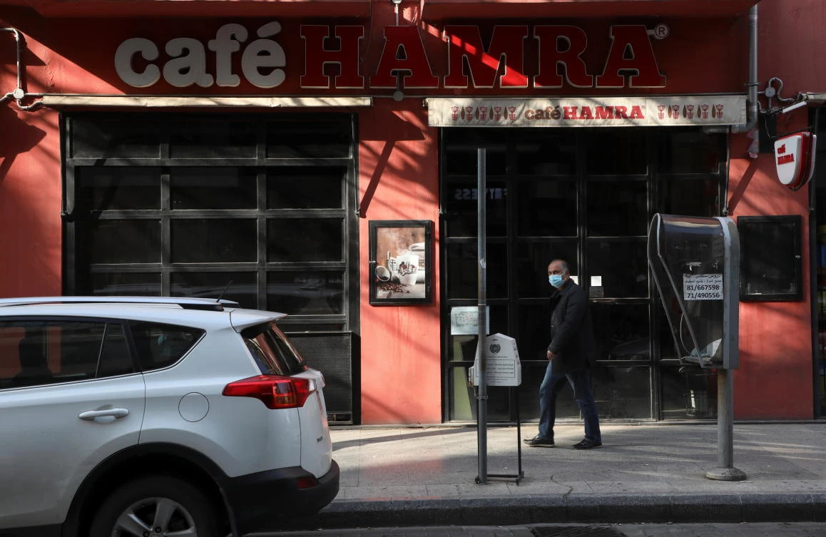 A man walks past a closed cafe in Beirut. (Reuters)