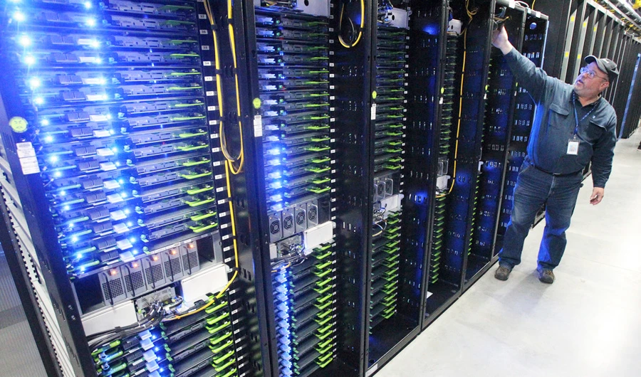 In this Oct. 15, 2013 file photo, Chuck Goolsbee, site director for Facebook's Prineville data centers, shows the computer servers that store users' photos and other data at the Facebook site in Prineville Ore. (AP)