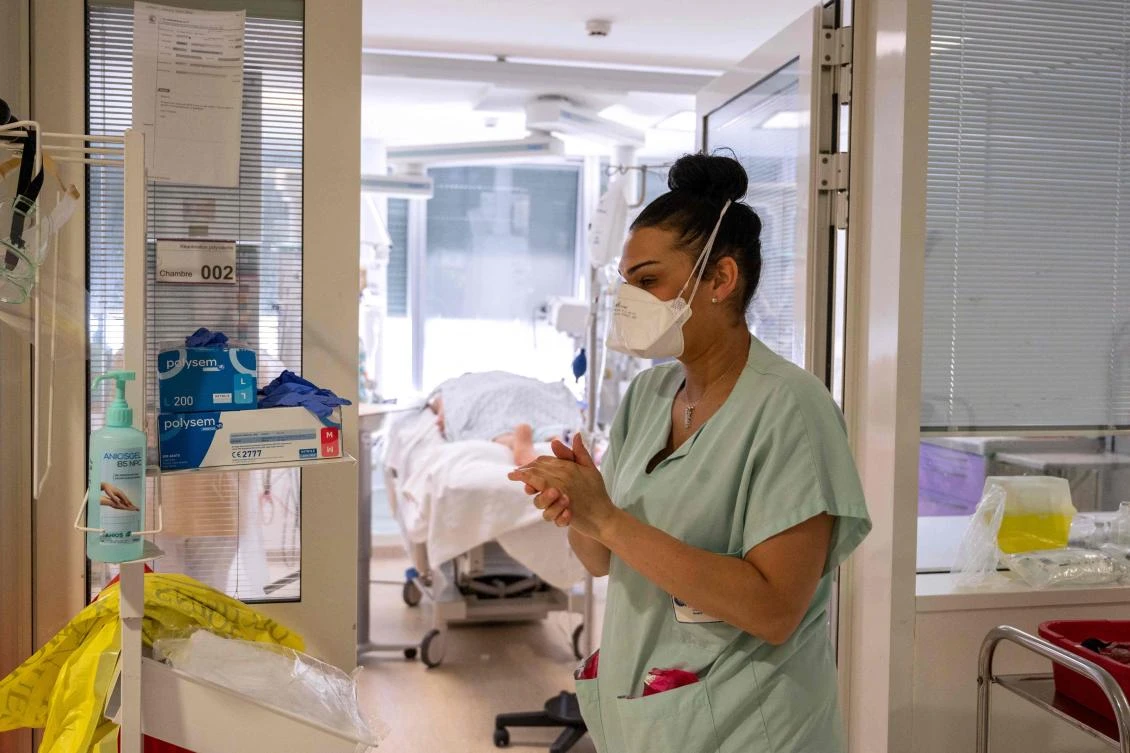 Paris is going through a third wave of the coronavirus pandemic which risks putting even more strain on saturated hospitals. (AFP)